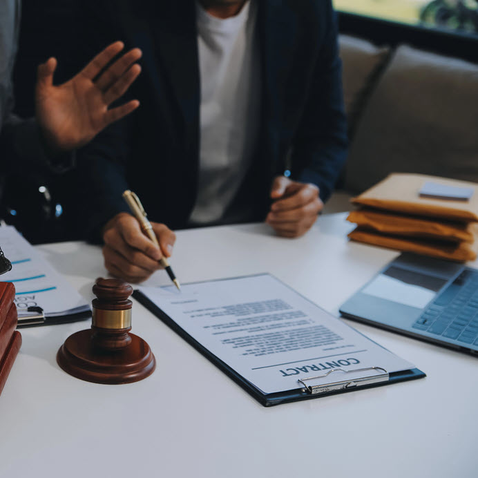 Legal document assistant helping a client review paperwork in Los Angeles CA